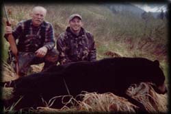 Wayne Benson and Brent Benson of Illinois posing with Wayne's Spring Black Bear