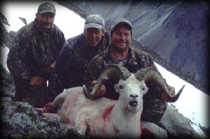 Brian Wagner of Howard Lake, MN (right), with assistant guide John Williams (center) and his last day Dall Ram.  Brain also took a Mt. Goat earlier in the hunt
